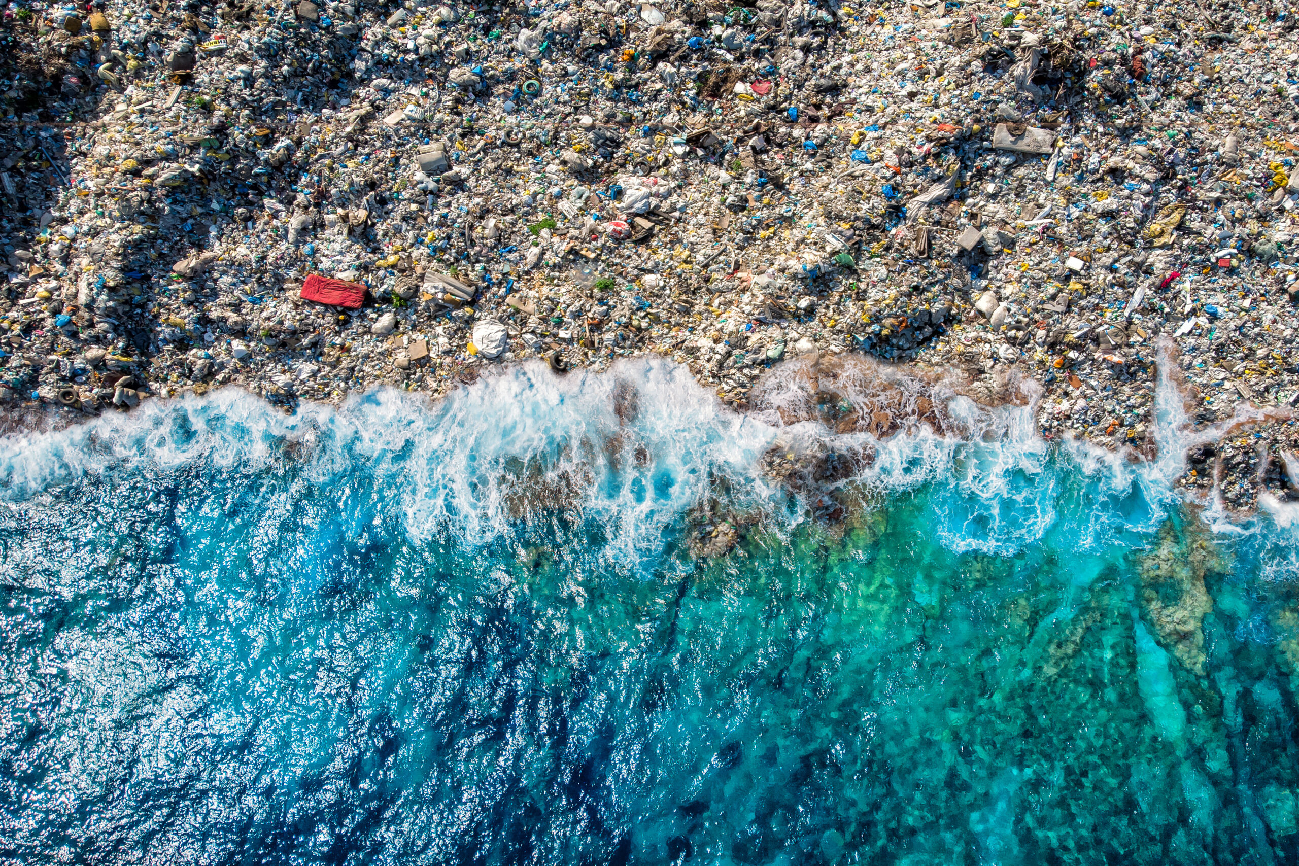 Concept environmental pollution ocean and water with plastic and human waste. Aerial top view.