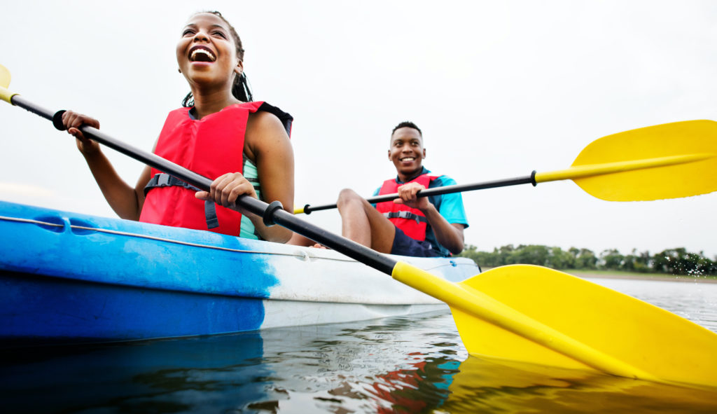 Ocean literacy and conservation behavior change: two people canoeing in a lake