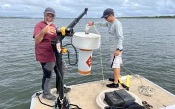 Dropping buoys into the water from our new boat