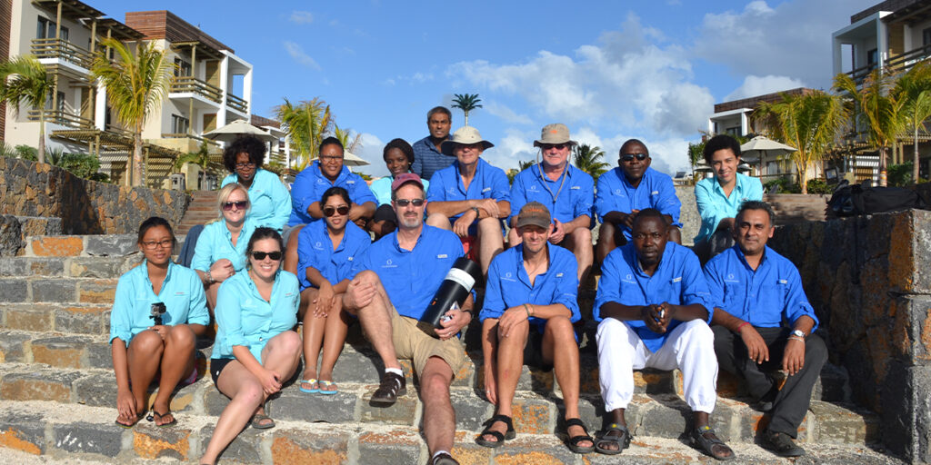 Scientists with pH sensor on beach