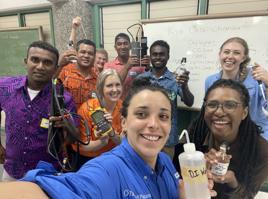 Our team posing with a group during a training